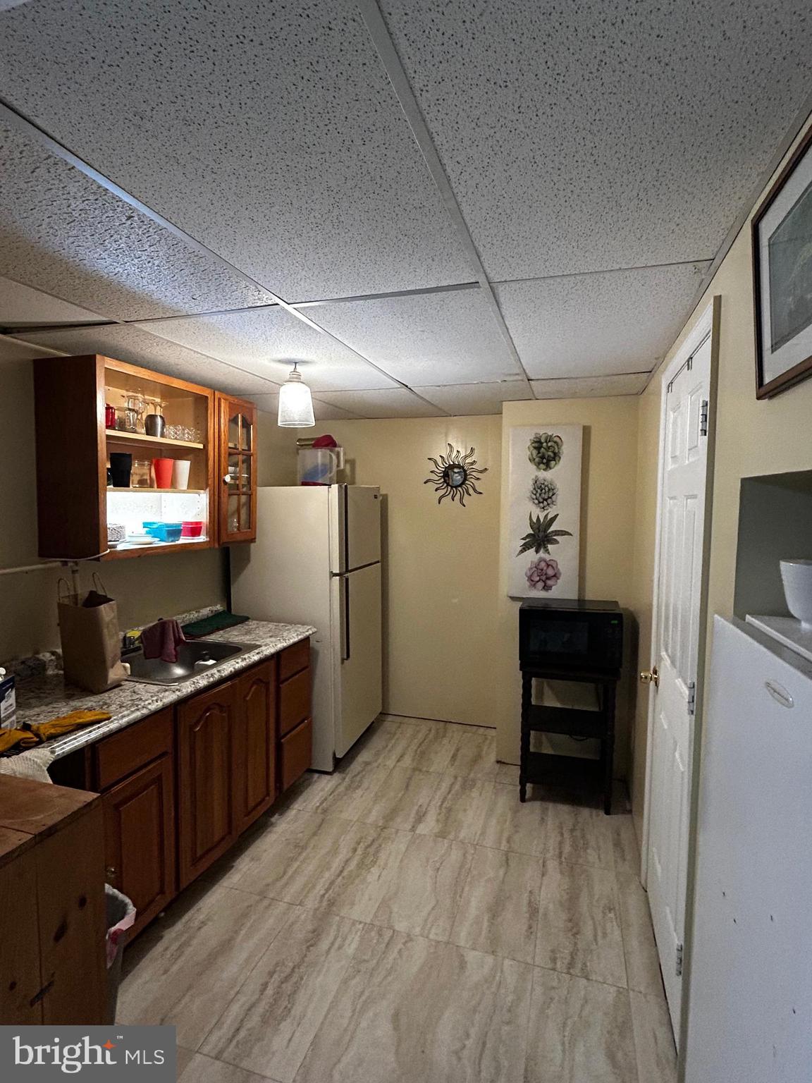 436 Hinsons Ford Road Amissville, VA 20106 - Photo 41 of 54 a kitchen with refrigerator cabinets and wooden floor