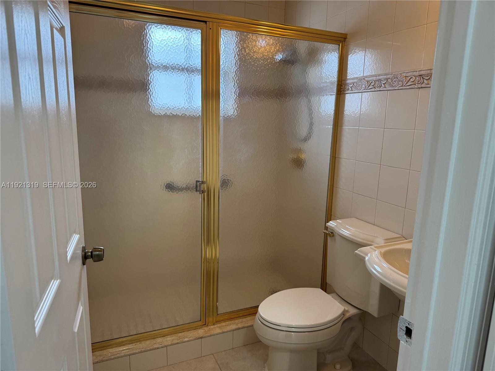 5332 Southwest 142nd Place Miami, FL 33175 - Photo 13 of 30 a bathroom with a toilet and a shower