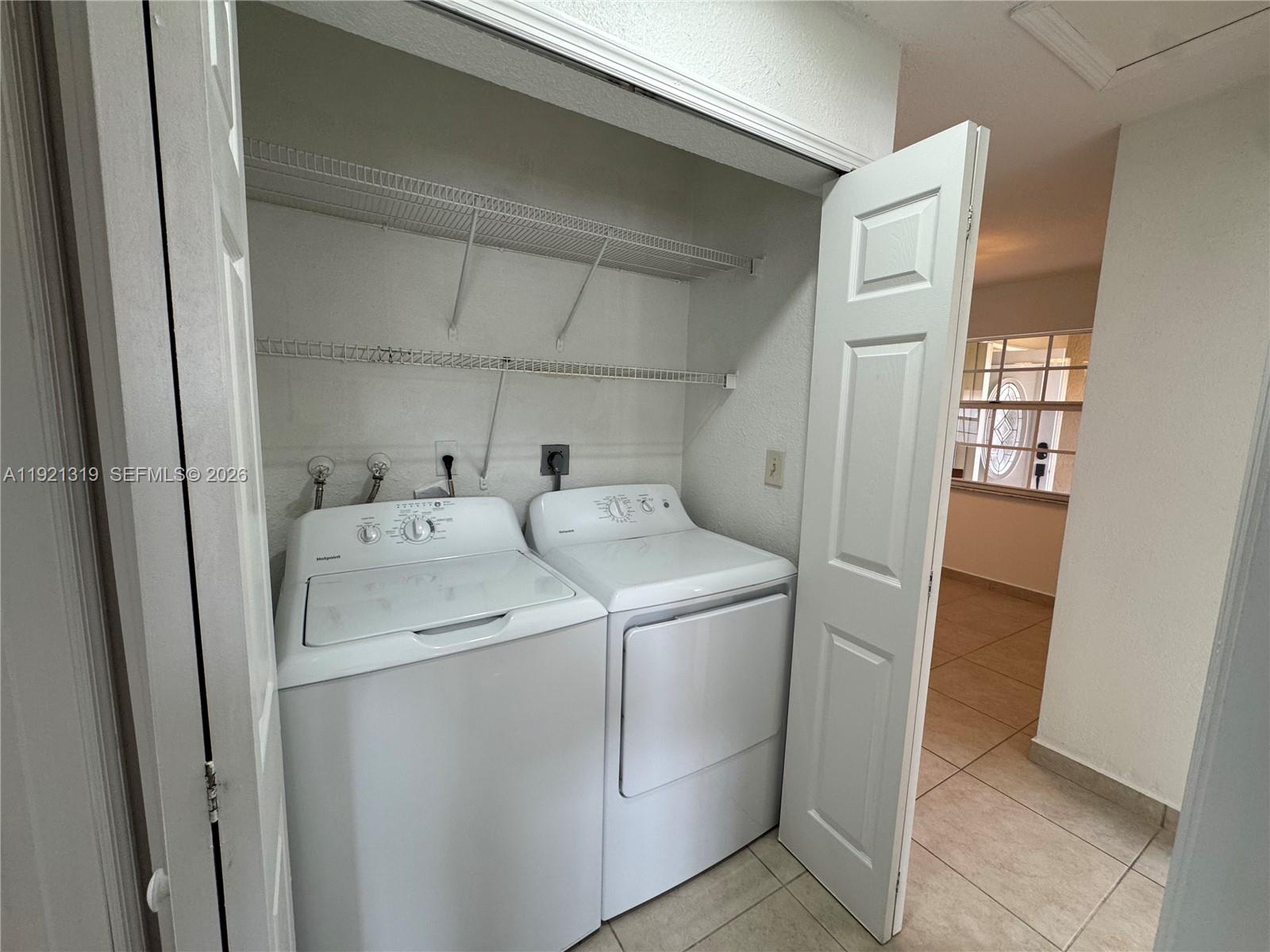 5332 Southwest 142nd Place Miami, FL 33175 - Photo 14 of 30 a utility room with dryer and washer