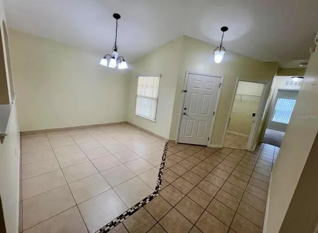 wooden floor in an empty room with a mirror