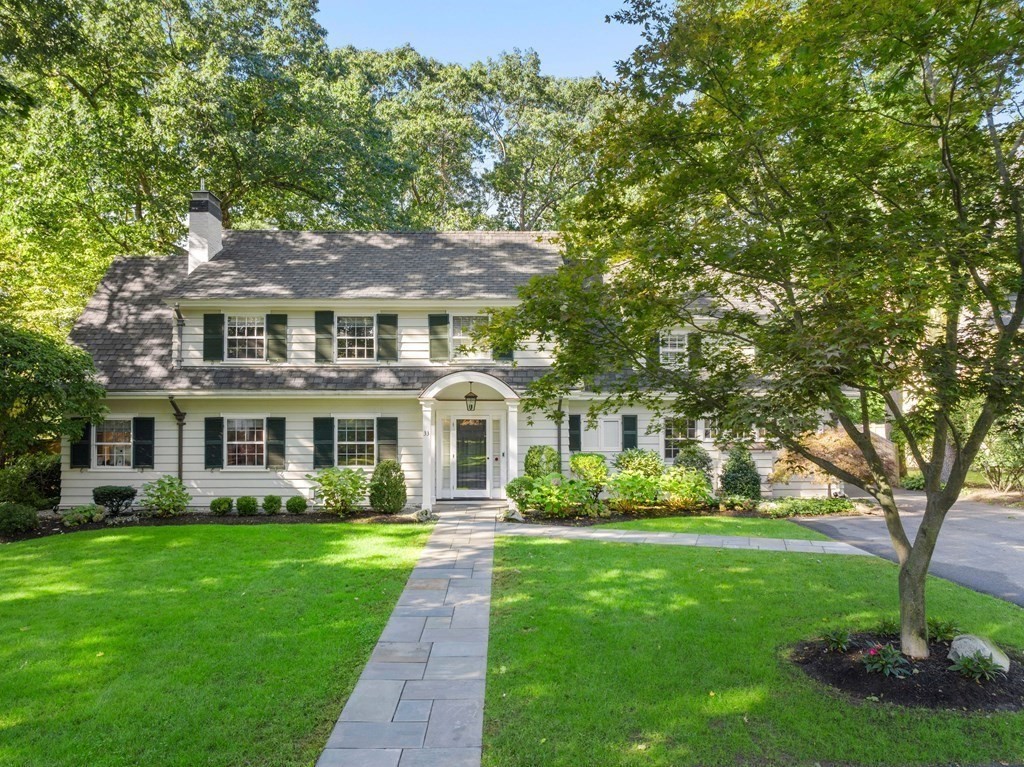 33 Damien Road Wellesley, MA 02481 - Photo 1 of 41 a front view of a house with a garden and plants
