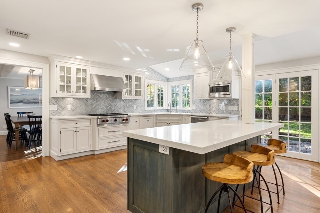 33 Damien Road Wellesley, MA 02481 - Photo 12 of 41 a kitchen with stainless steel appliances granite countertop a sink a stove and a wooden floors
