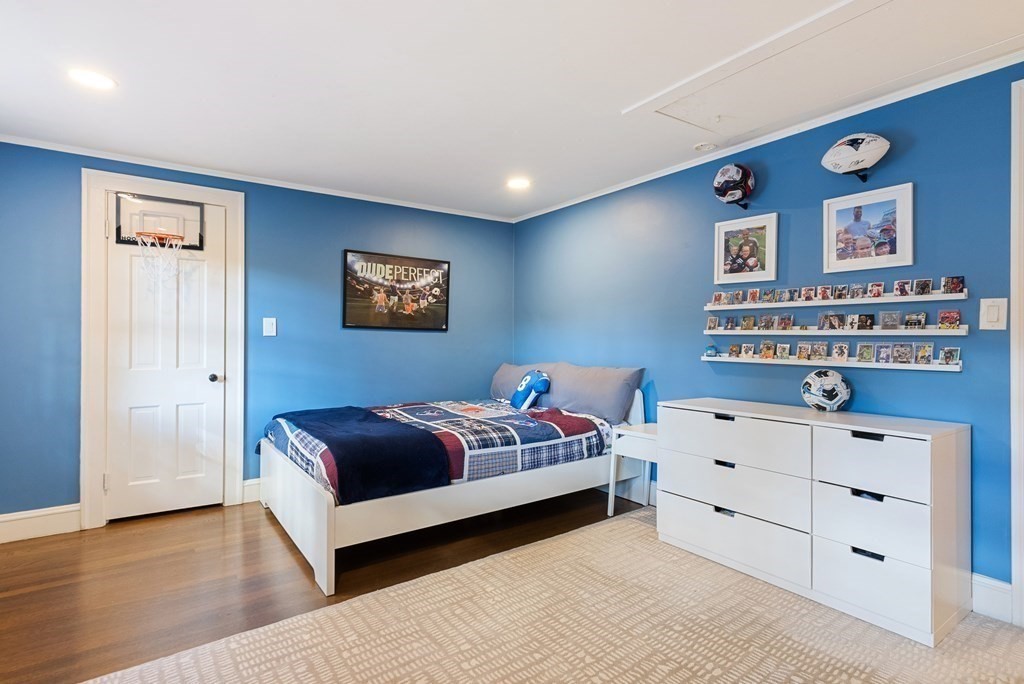 33 Damien Road Wellesley, MA 02481 - Photo 29 of 41 a bedroom with a bed and a dresser