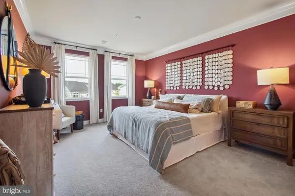 a spacious bedroom with a bed and window