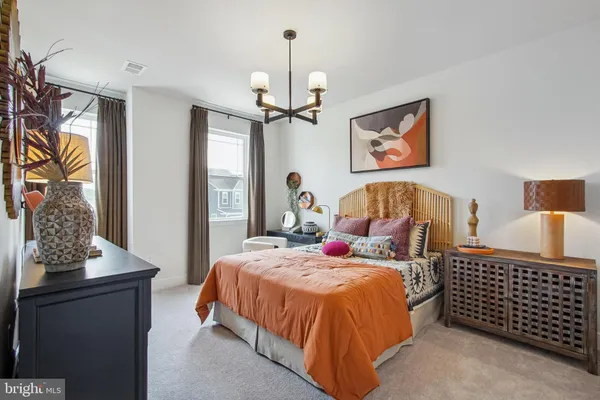 a bedroom with bed and a window