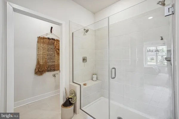 a bathroom with a shower and a tub