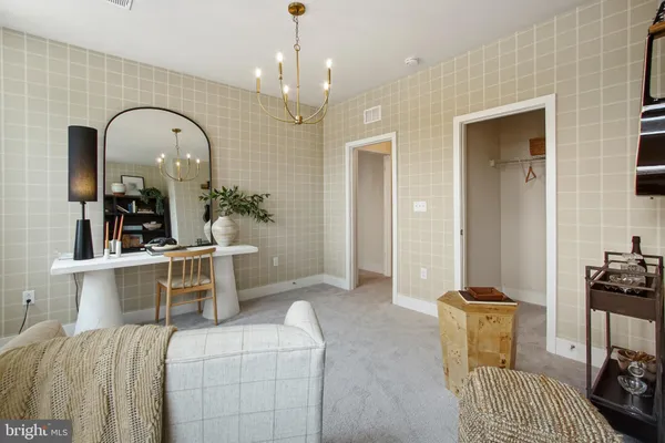 a bedroom with a bed and ceiling fan