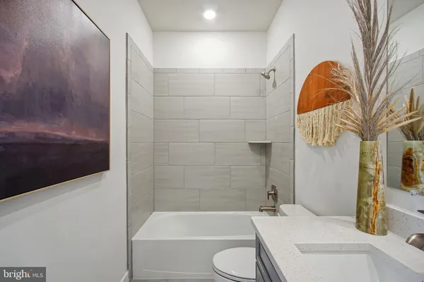 a bathroom with a sink and bathtub