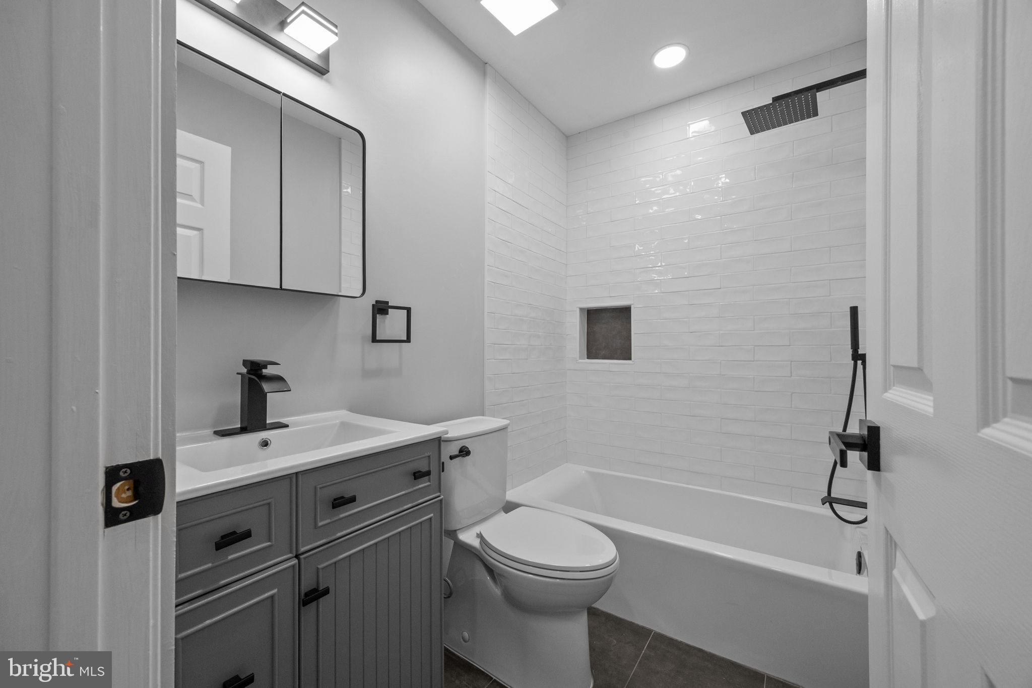 548 Susan Drive King of Prussia, PA 19406 - Photo 19 of 27 a bathroom with a sink a toilet and shower