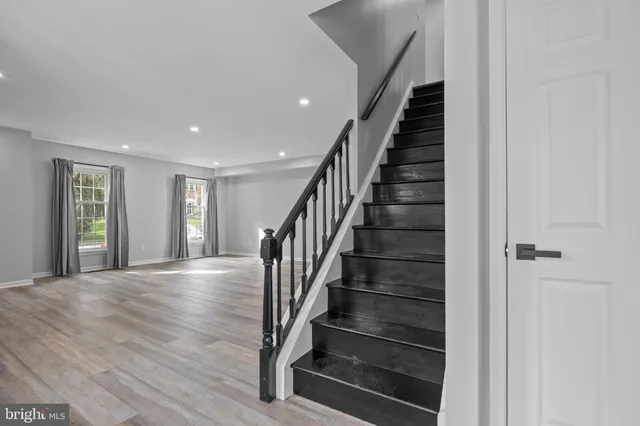a view of an entryway with wooden floor