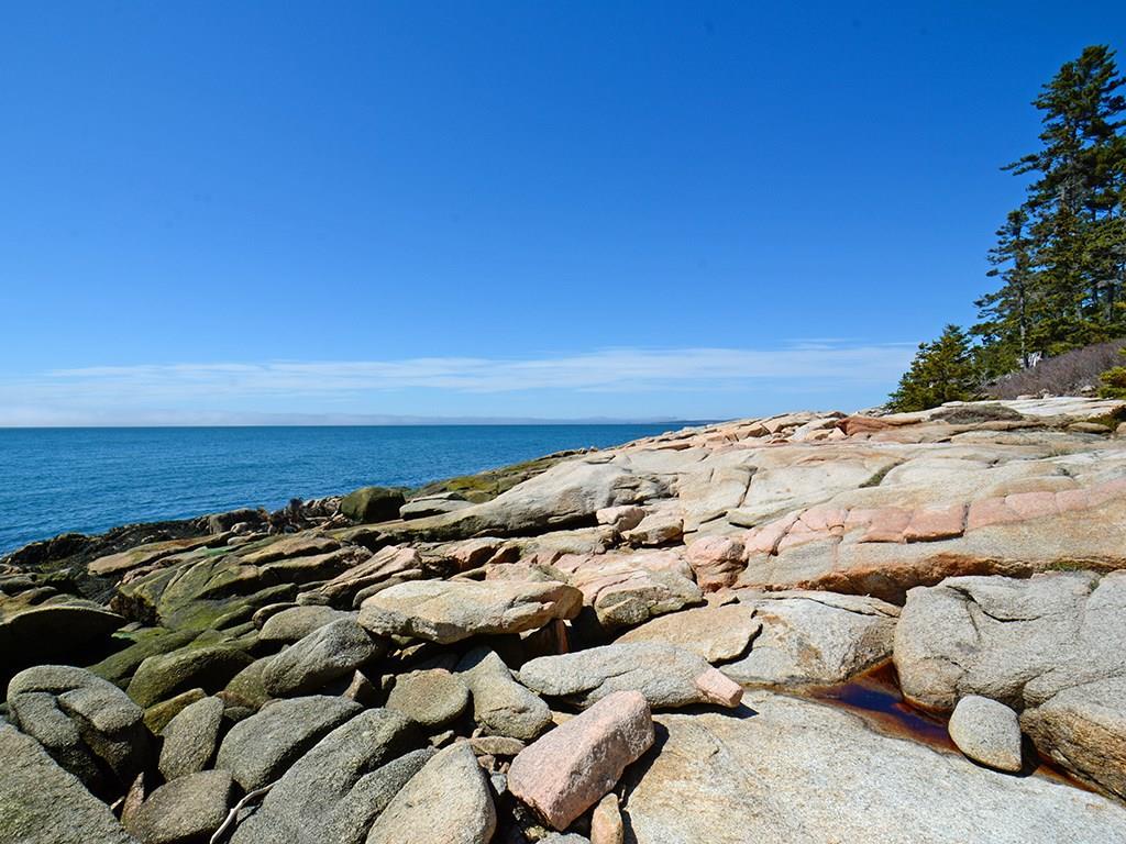 555 Jericho Bay Road Swans Island, ME 04685 - Photo 3 of 35 Stunning pink granite coastline.