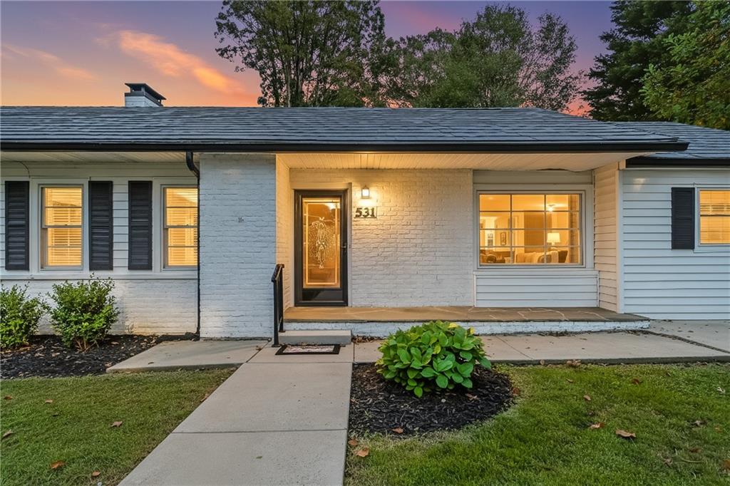 531 Crestview Terrace Gainesville, GA 30501 - Photo 1 of 54 a front view of a house with a yard