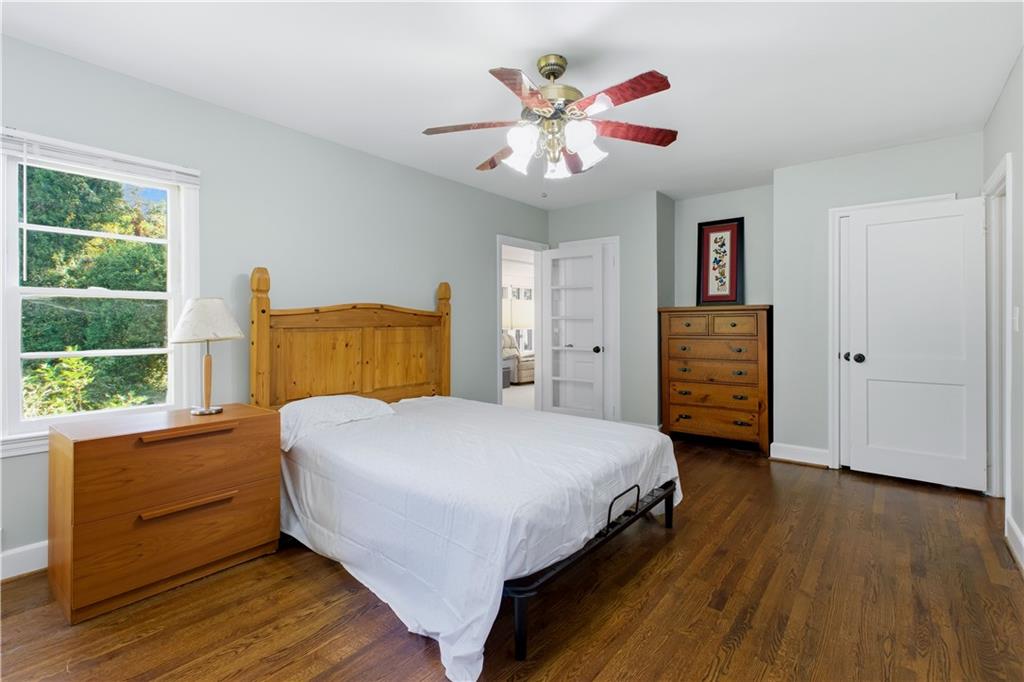 531 Crestview Terrace Gainesville, GA 30501 - Photo 19 of 54 a bedroom with a bed and a chandelier