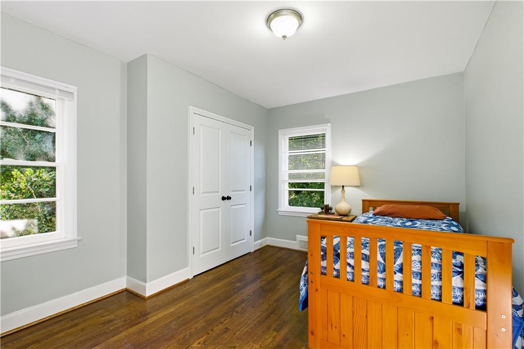 531 Crestview Terrace Gainesville, GA 30501 - Photo 29 of 54 a bedroom with a bed and wooden floor