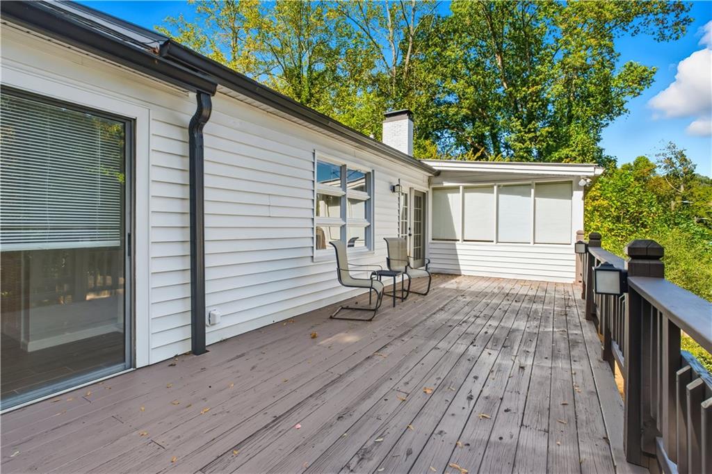 531 Crestview Terrace Gainesville, GA 30501 - Photo 30 of 54 a porch with seating space and hardwood floor