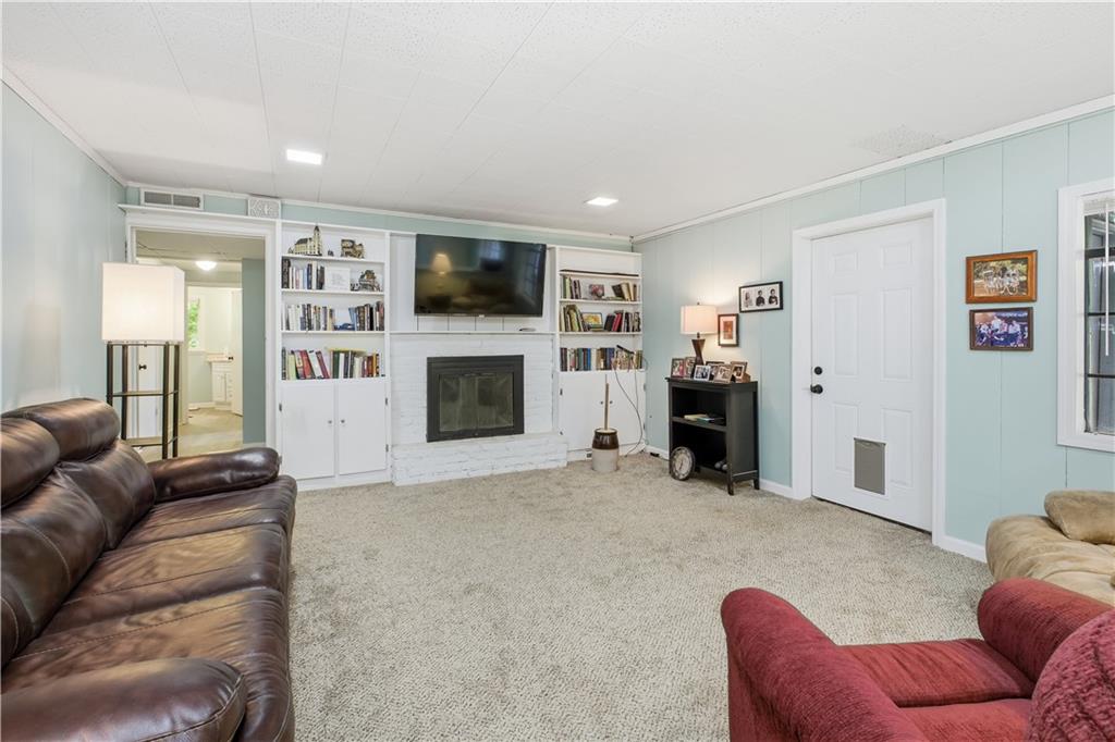 531 Crestview Terrace Gainesville, GA 30501 - Photo 35 of 54 a living room with furniture and a fireplace