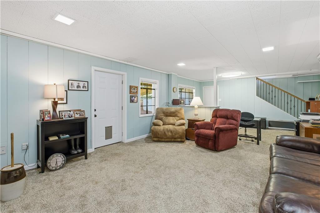 531 Crestview Terrace Gainesville, GA 30501 - Photo 36 of 54 a living room with furniture a window and a lamp