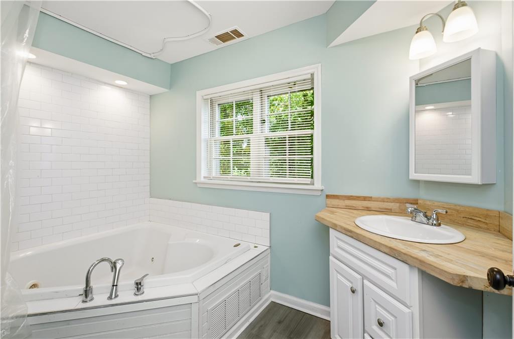 531 Crestview Terrace Gainesville, GA 30501 - Photo 38 of 54 a bathroom with a bathtub and a sink