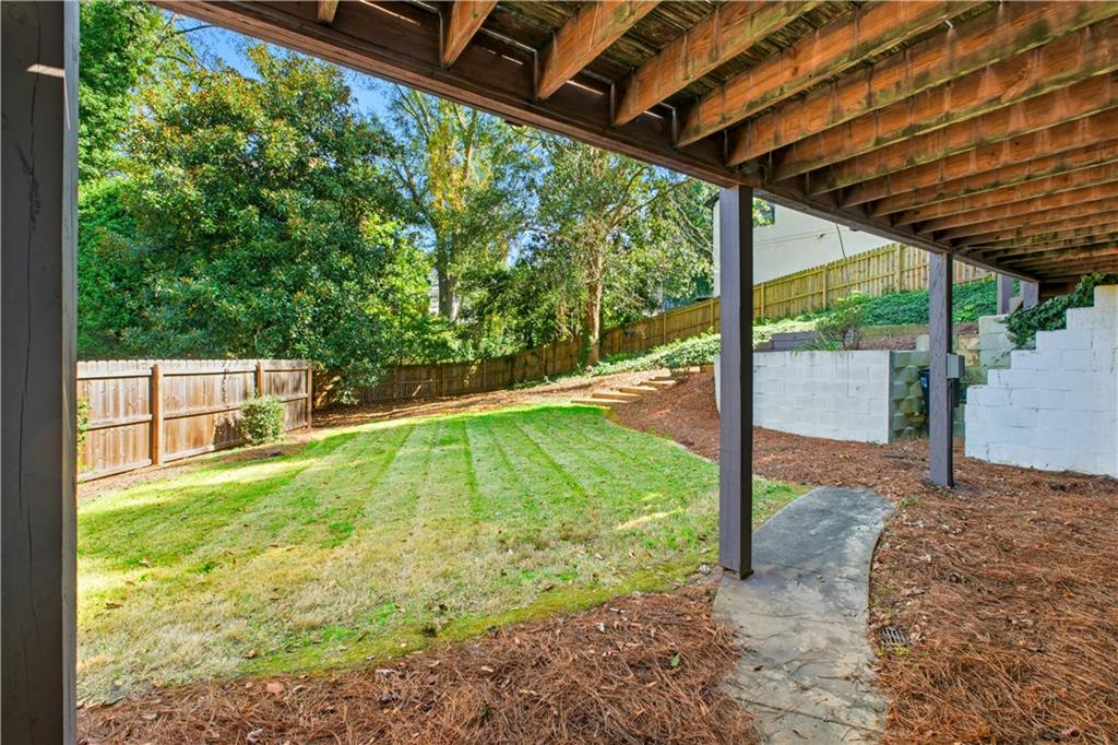 531 Crestview Terrace Gainesville, GA 30501 - Photo 46 of 54 a view of a backyard with floor to ceiling windows with wooden roof