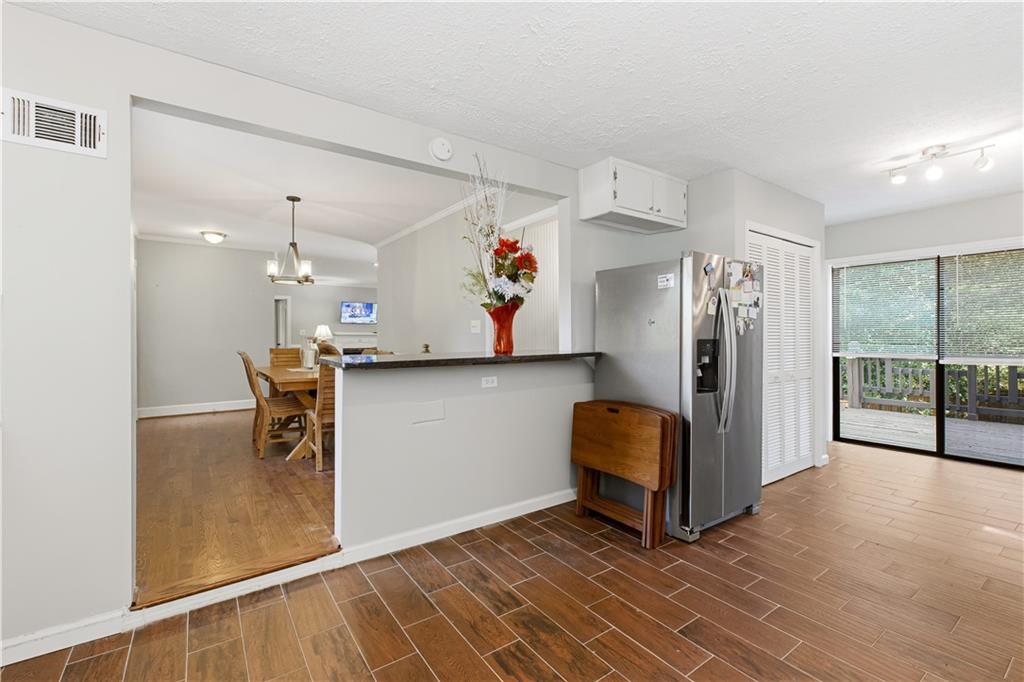 531 Crestview Terrace Gainesville, GA 30501 - Photo 10 of 54 a view of kitchen with stainless steel appliances granite countertop a refrigerator and a stove top oven