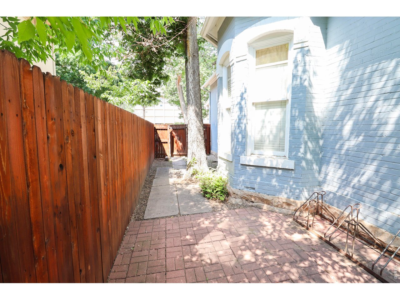 608 South Howes Street Fort Collins, CO 80521 - Photo 27 of 28 a view of a backyard with wooden fence