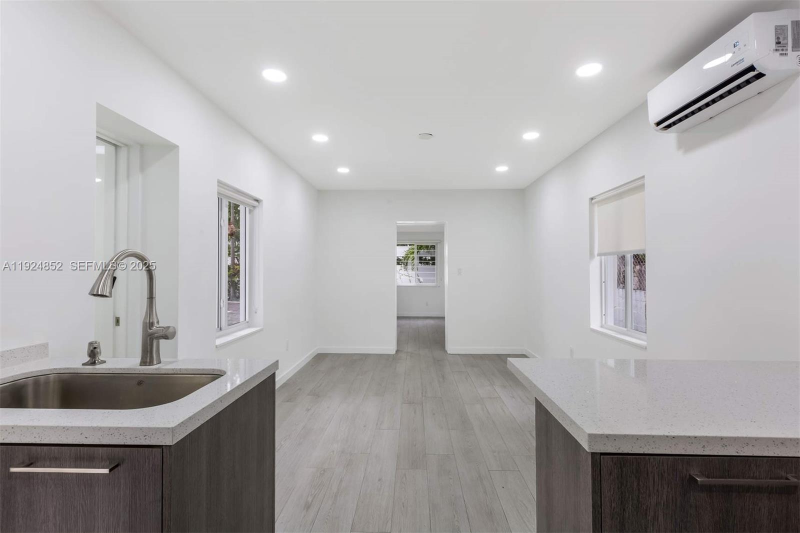 623 Northeast 61st Street, Unit 5 Miami, FL 33137 - Photo 6 of 12 a kitchen with sink and cabinets