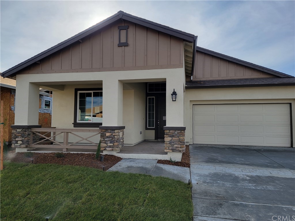 a front view of a house with sitting area