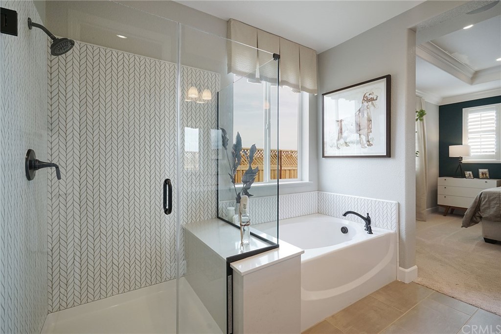 3445 Chamberlain Run Chico, CA 95973 - Photo 13 of 17 a bathroom with a bathtub and a shower