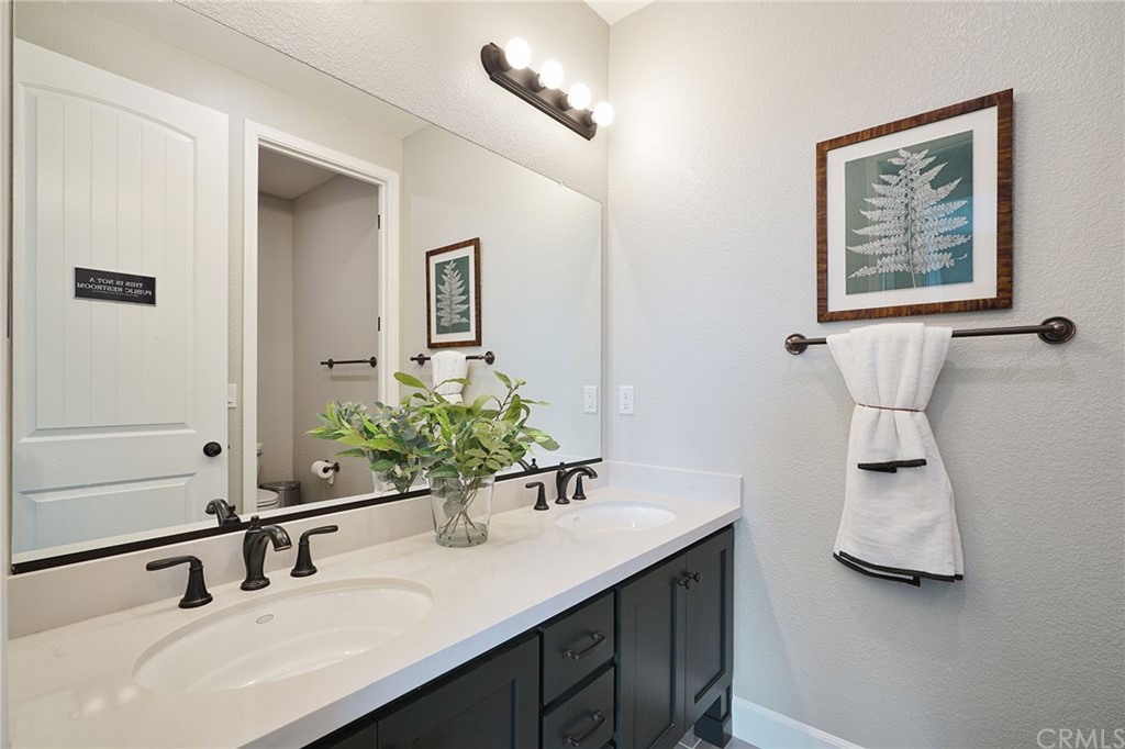 3445 Chamberlain Run Chico, CA 95973 - Photo 15 of 17 a bathroom with a sink and a mirror