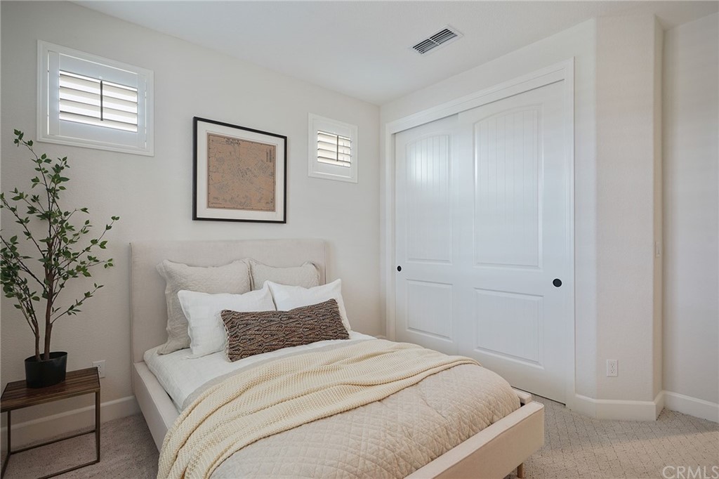 3445 Chamberlain Run Chico, CA 95973 - Photo 4 of 17 a bedroom with a bed and a potted plant