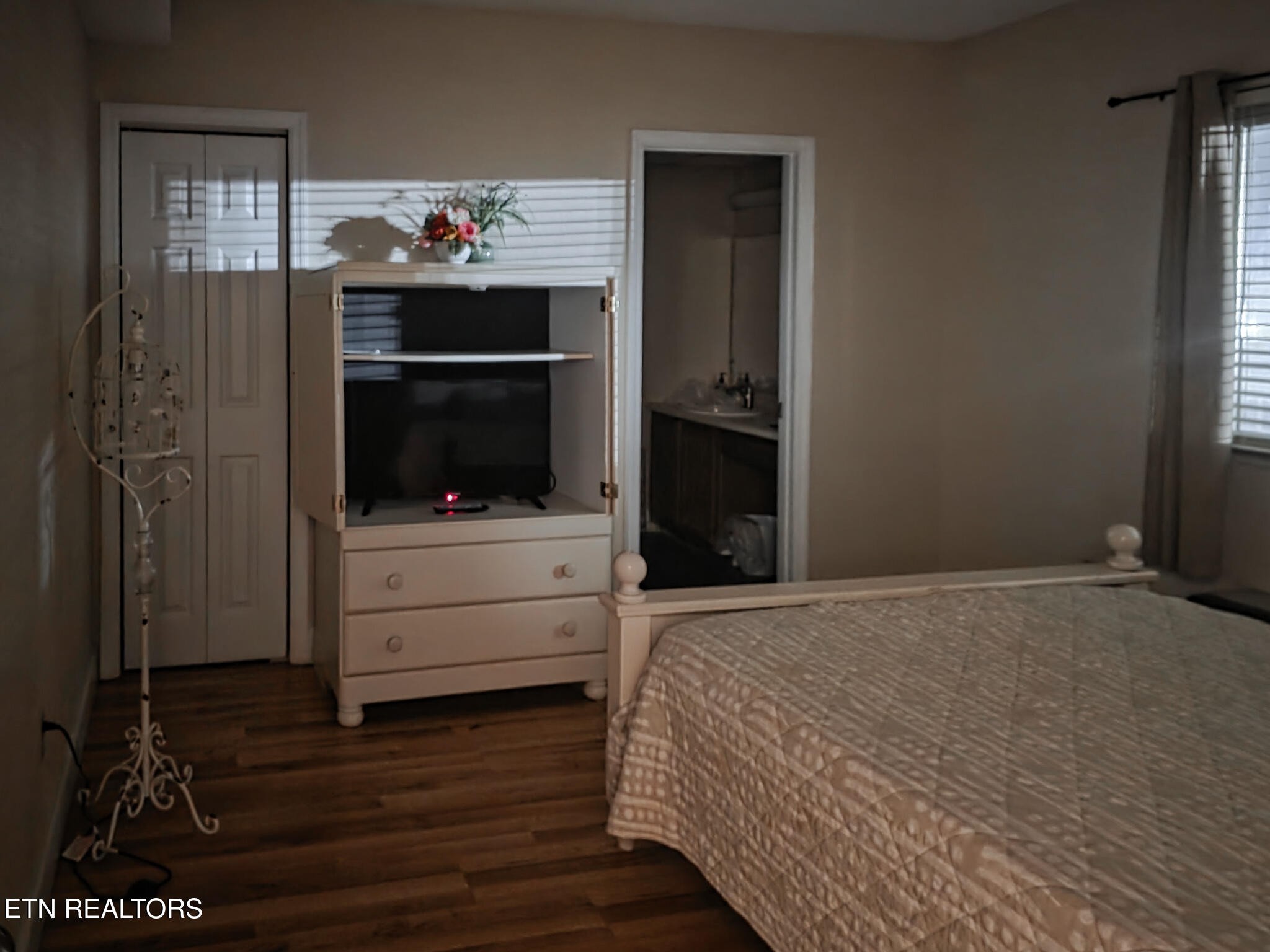 3215 North River Road, Unit STE 303 Sevierville, TN 37863 - Photo 7 of 7 a bedroom with a bed and a fireplace