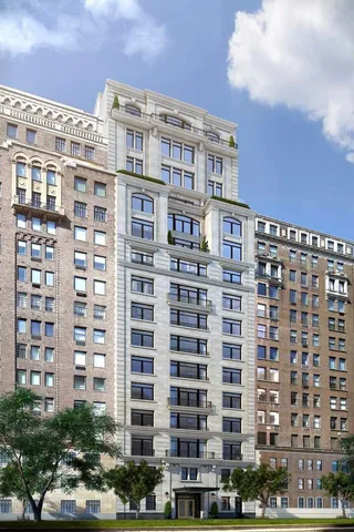 a building outdoor space with patio furniture and ocean view
