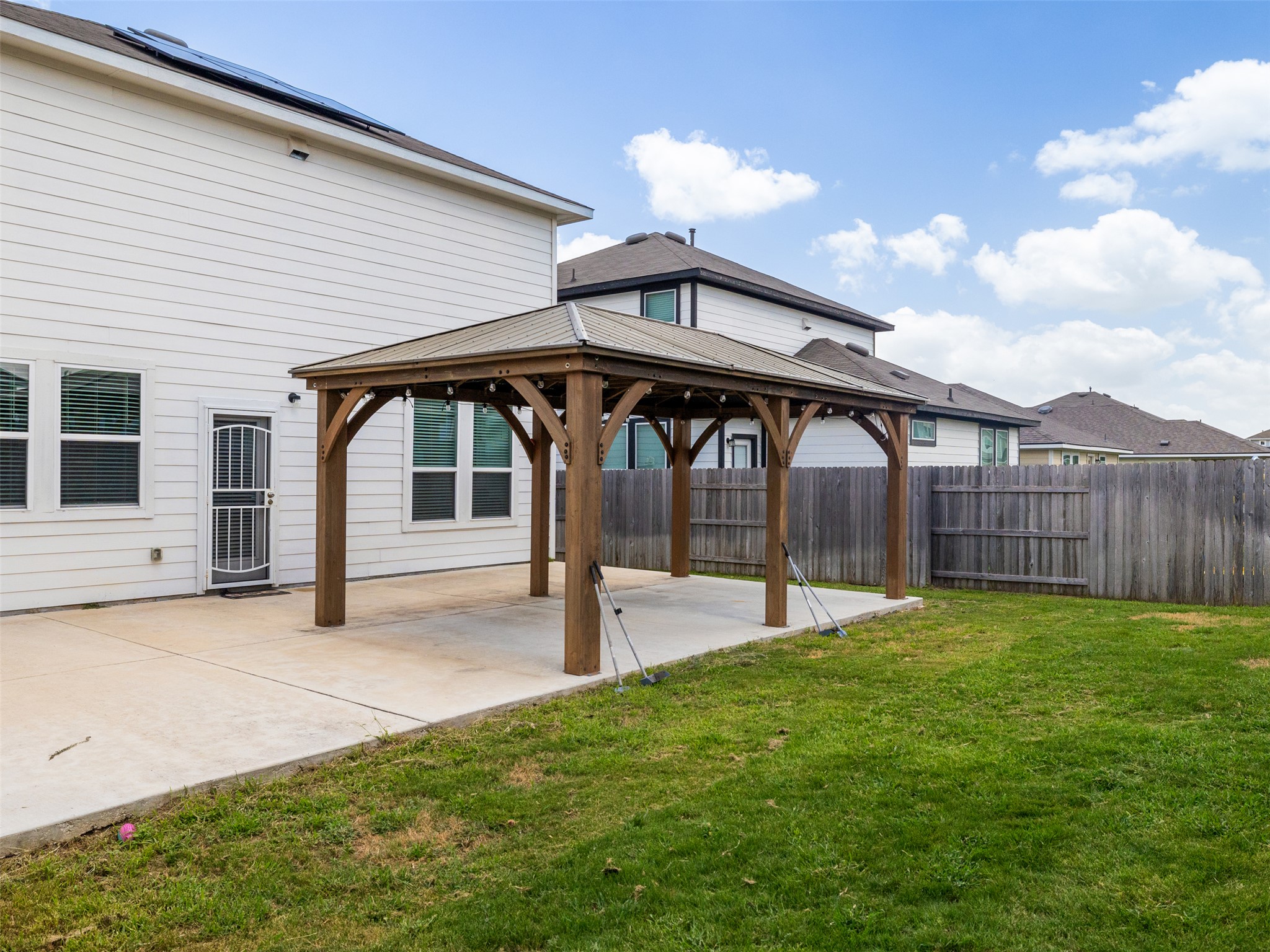 121 Graver Street Georgetown, TX 78626 - Photo 25 of 28 Enjoy outdoor gatherings with a sheltered patio and a generous, fenced yard.