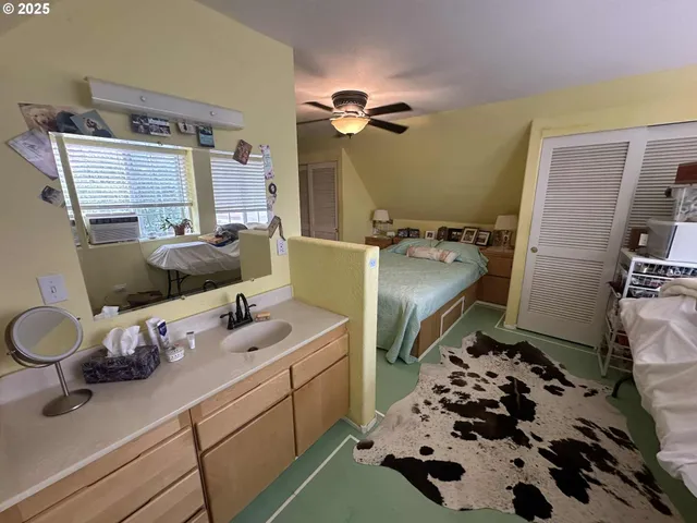 a bathroom with a sink mirror and toilet