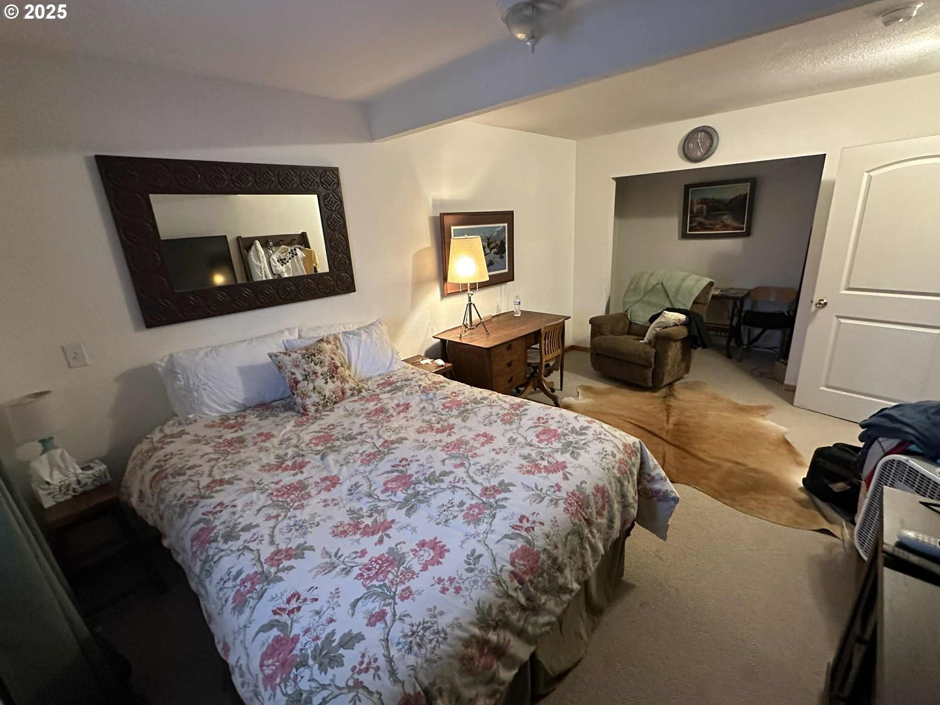 235 Rock Street Heppner, OR 97836 - Photo 23 of 27 a bedroom with a bed and wooden floor