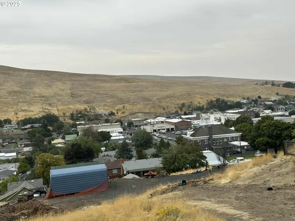 an aerial view of a house with a ocean view