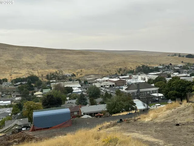 an aerial view of a house with a ocean view