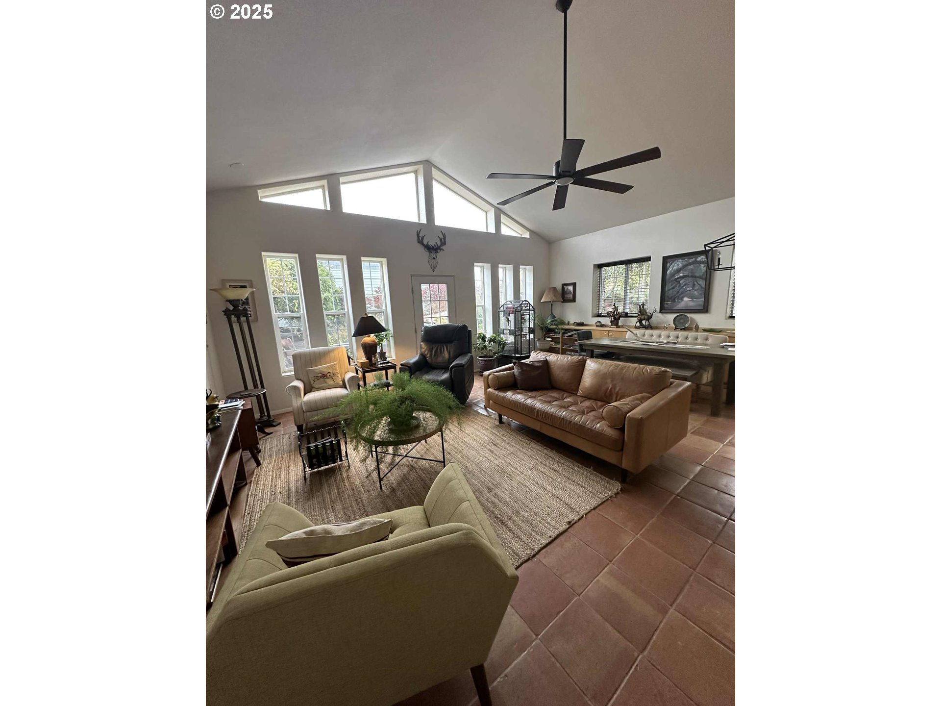 235 Rock Street Heppner, OR 97836 - Photo 4 of 27 a living room with furniture and a chandelier