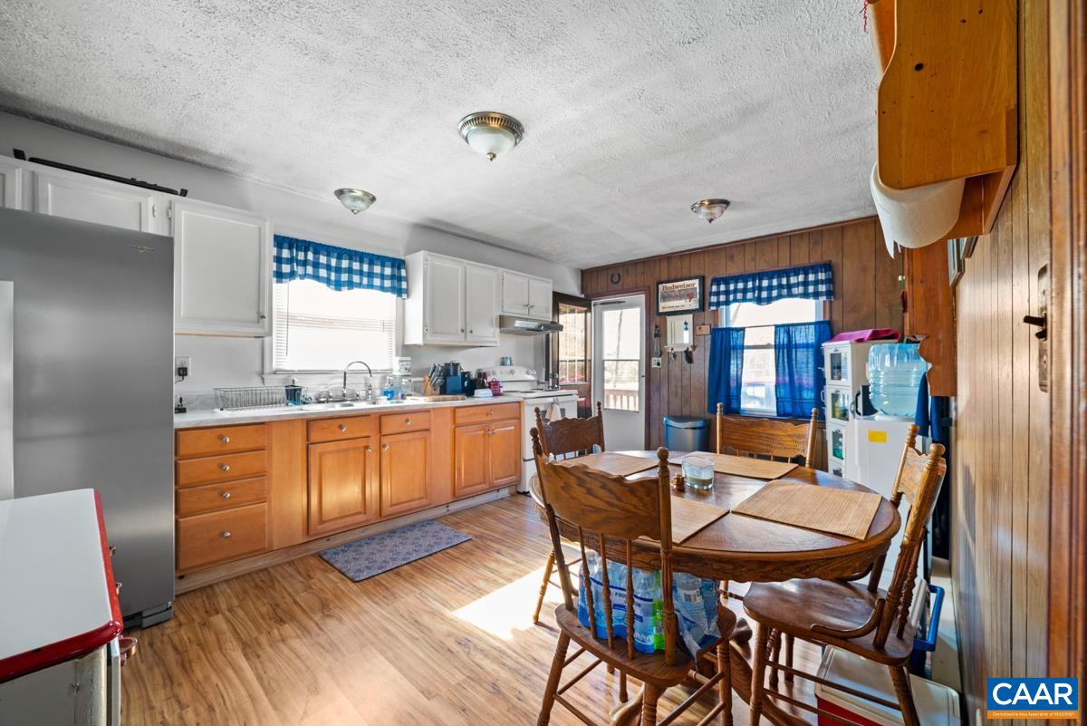 838 Matthew Mill Road Ruckersville, VA 22968 - Photo 4 of 12 a kitchen with a table and chairs in it