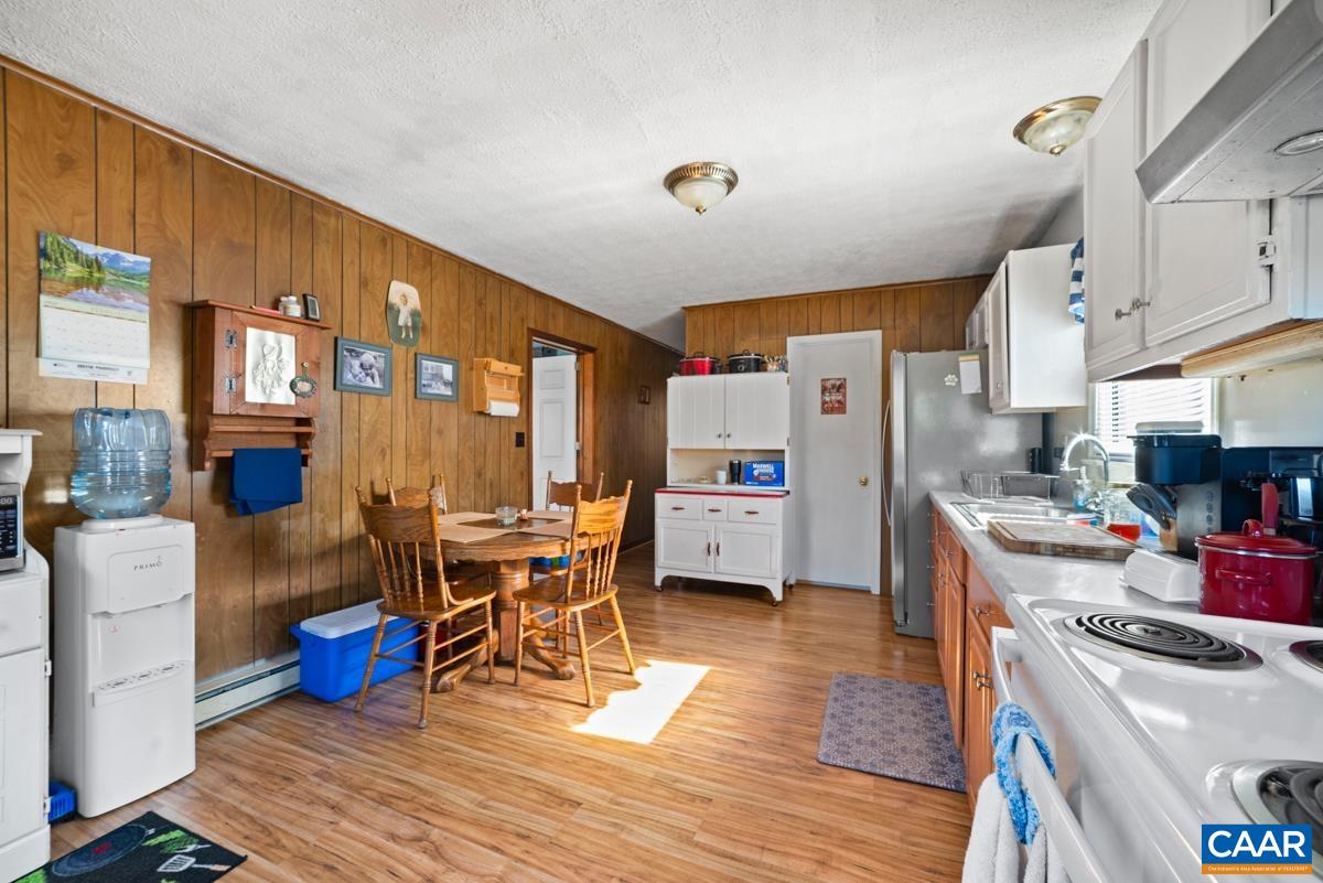 838 Matthew Mill Road Ruckersville, VA 22968 - Photo 5 of 12 a living room with lots of furniture and kitchen view