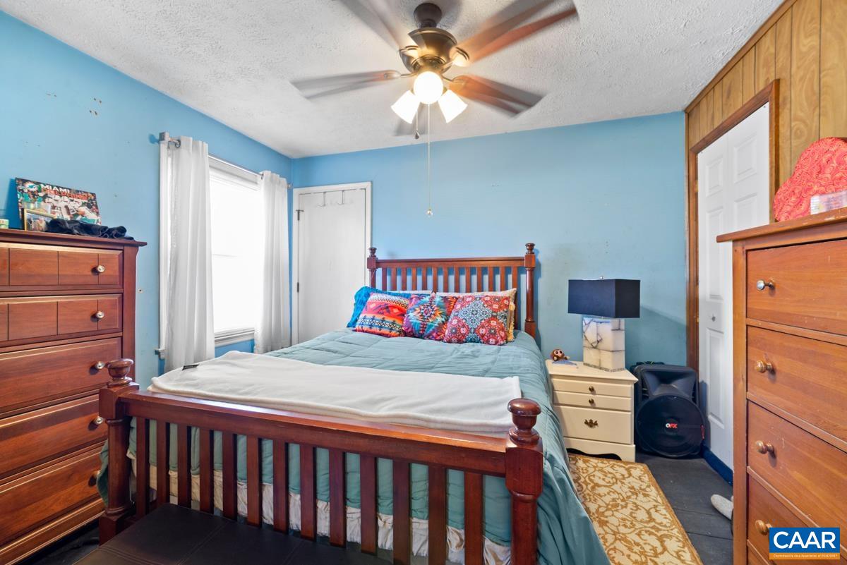 838 Matthew Mill Road Ruckersville, VA 22968 - Photo 8 of 12 a bedroom with a bed and a dresser in it