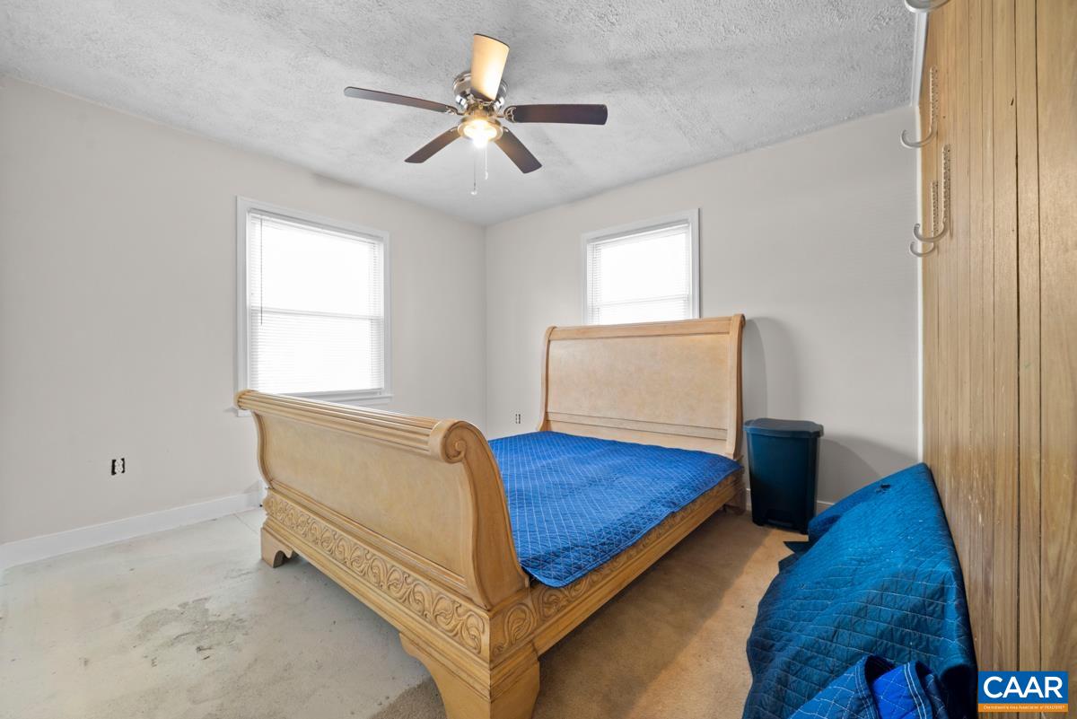 838 Matthew Mill Road Ruckersville, VA 22968 - Photo 9 of 12 a bedroom with a bed and a dresser