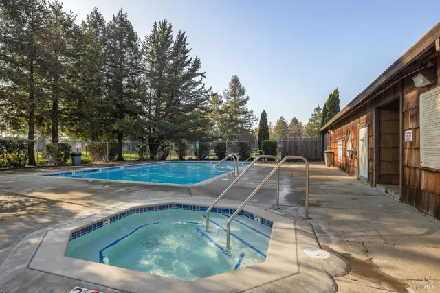 a view of swimming pool with a patio