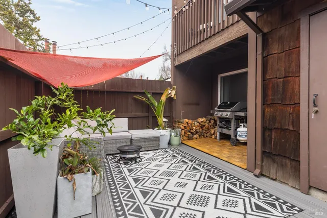 a view of a backyard with sitting area
