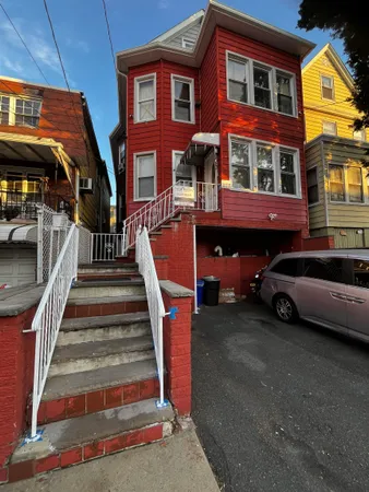 a car parked in front of a house
