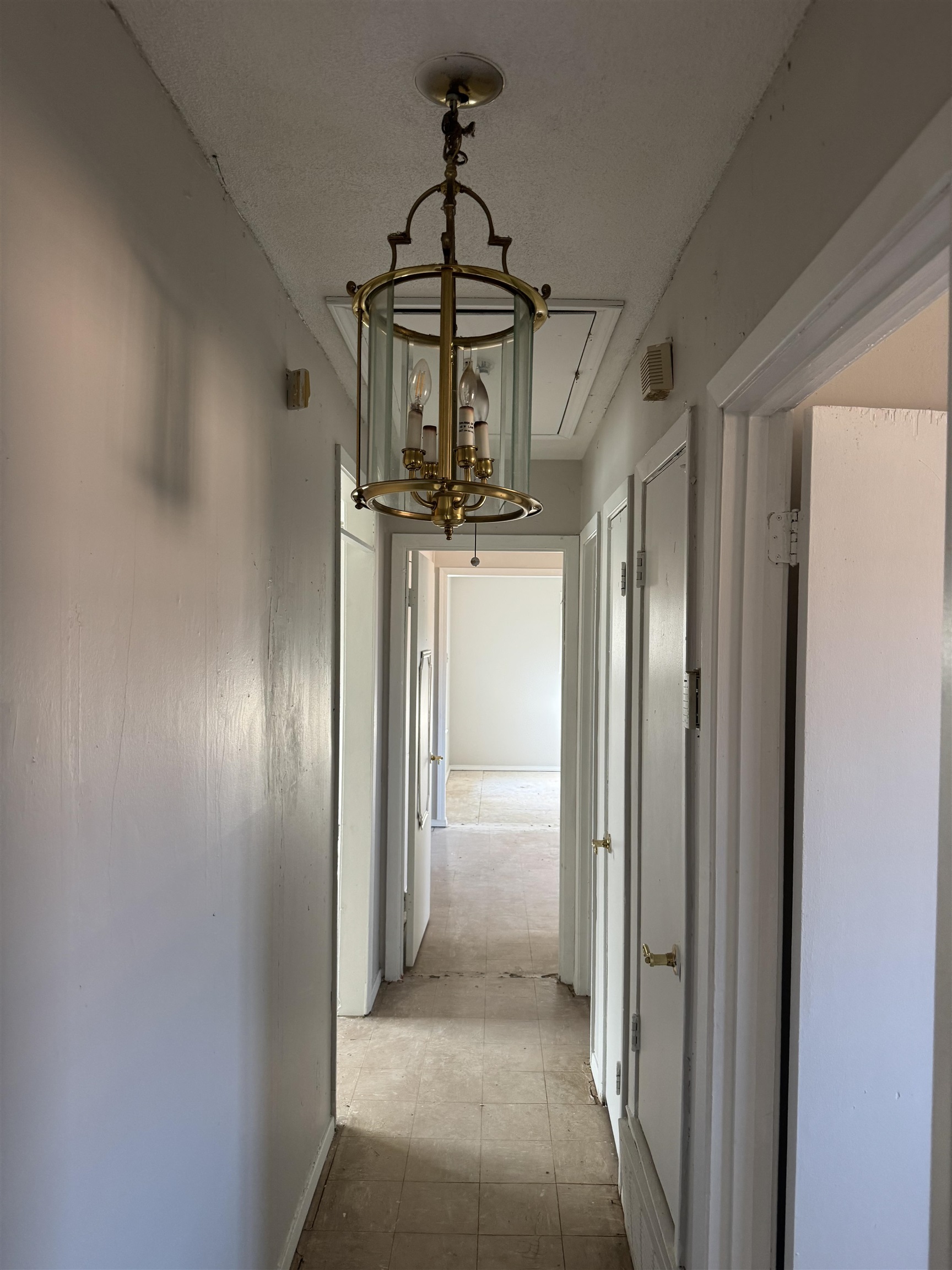 676 Nonconnah Road Memphis, TN 38109 - Photo 11 of 20 Hallway featuring hanging lights and baseboards