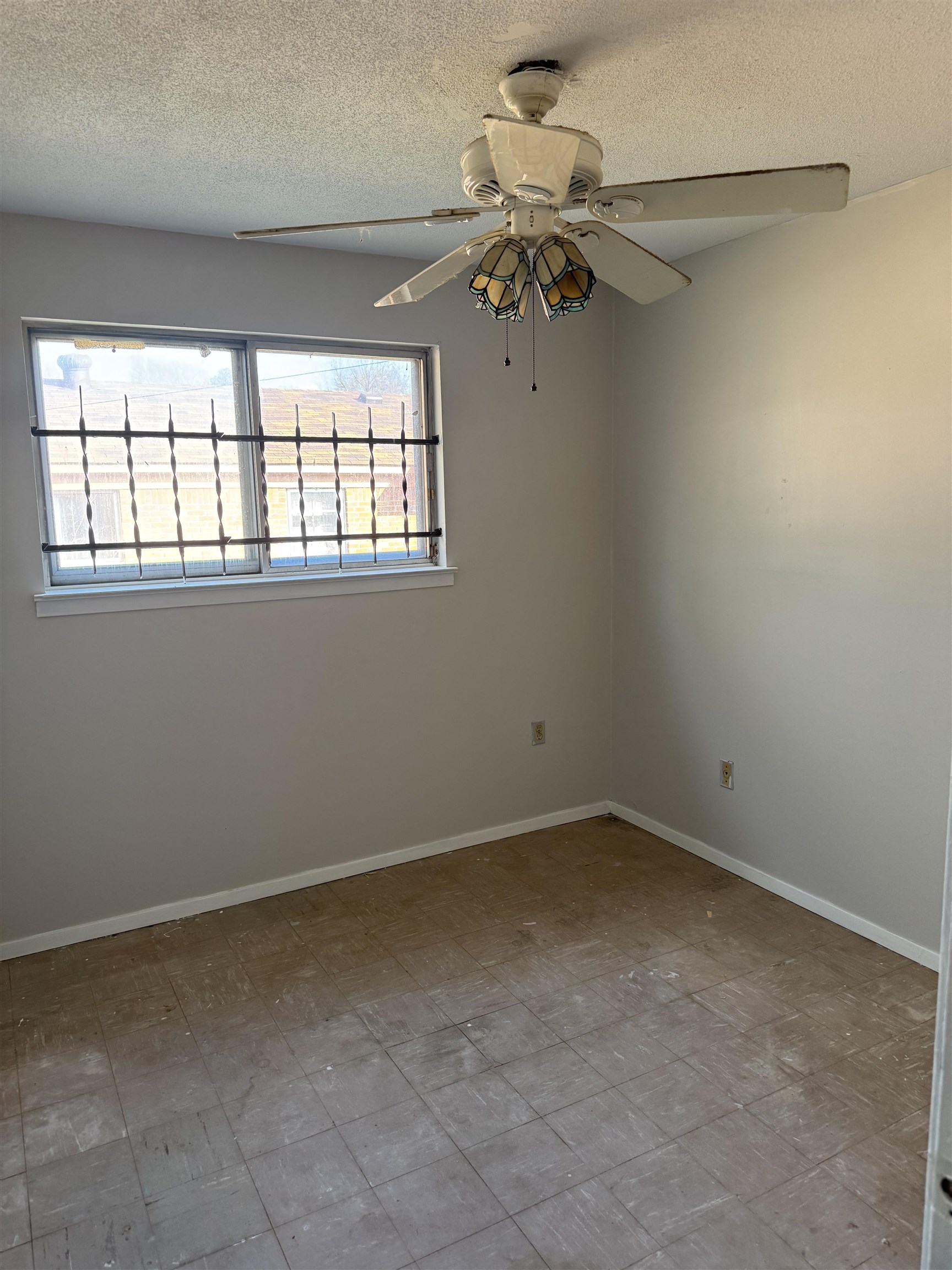 676 Nonconnah Road Memphis, TN 38109 - Photo 16 of 20 Empty room featuring a textured ceiling and ceiling fan