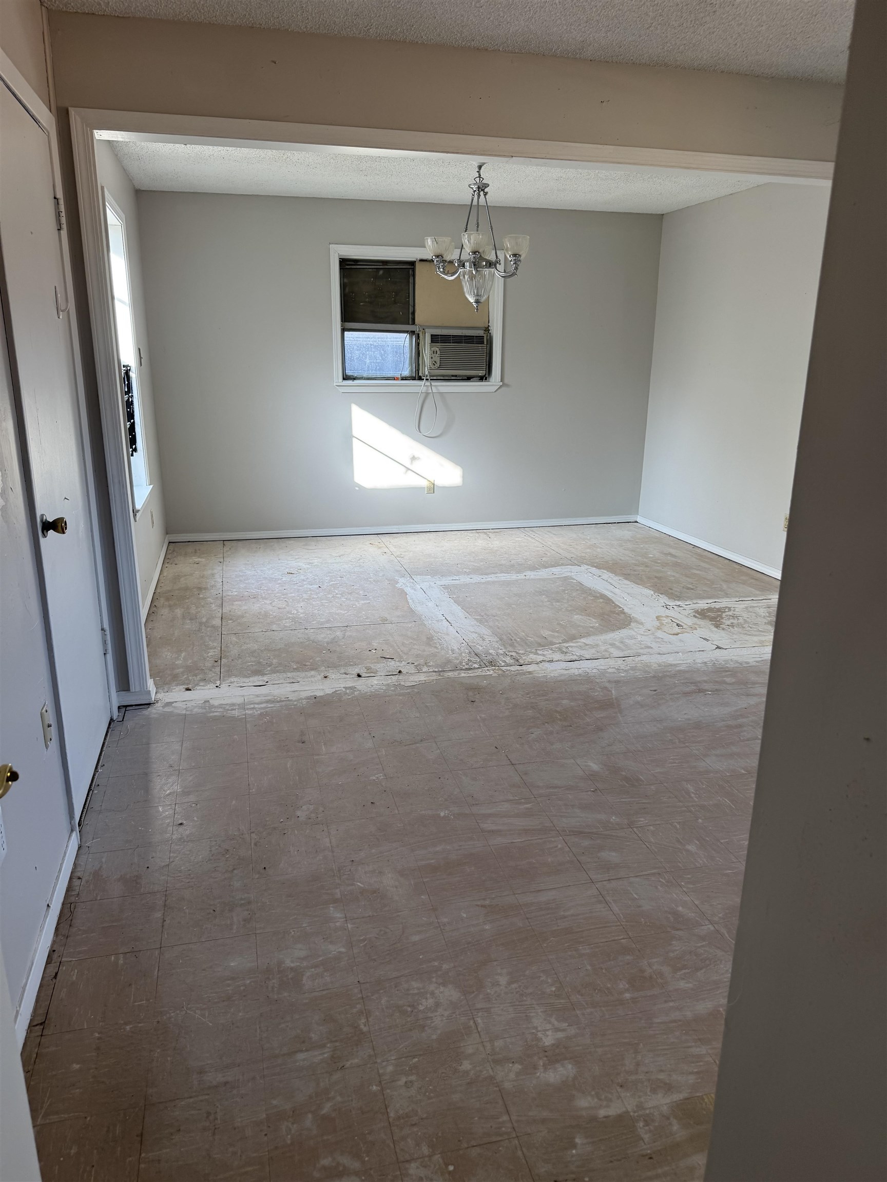 676 Nonconnah Road Memphis, TN 38109 - Photo 17 of 20 Unfurnished dining area featuring a chandelier and baseboards