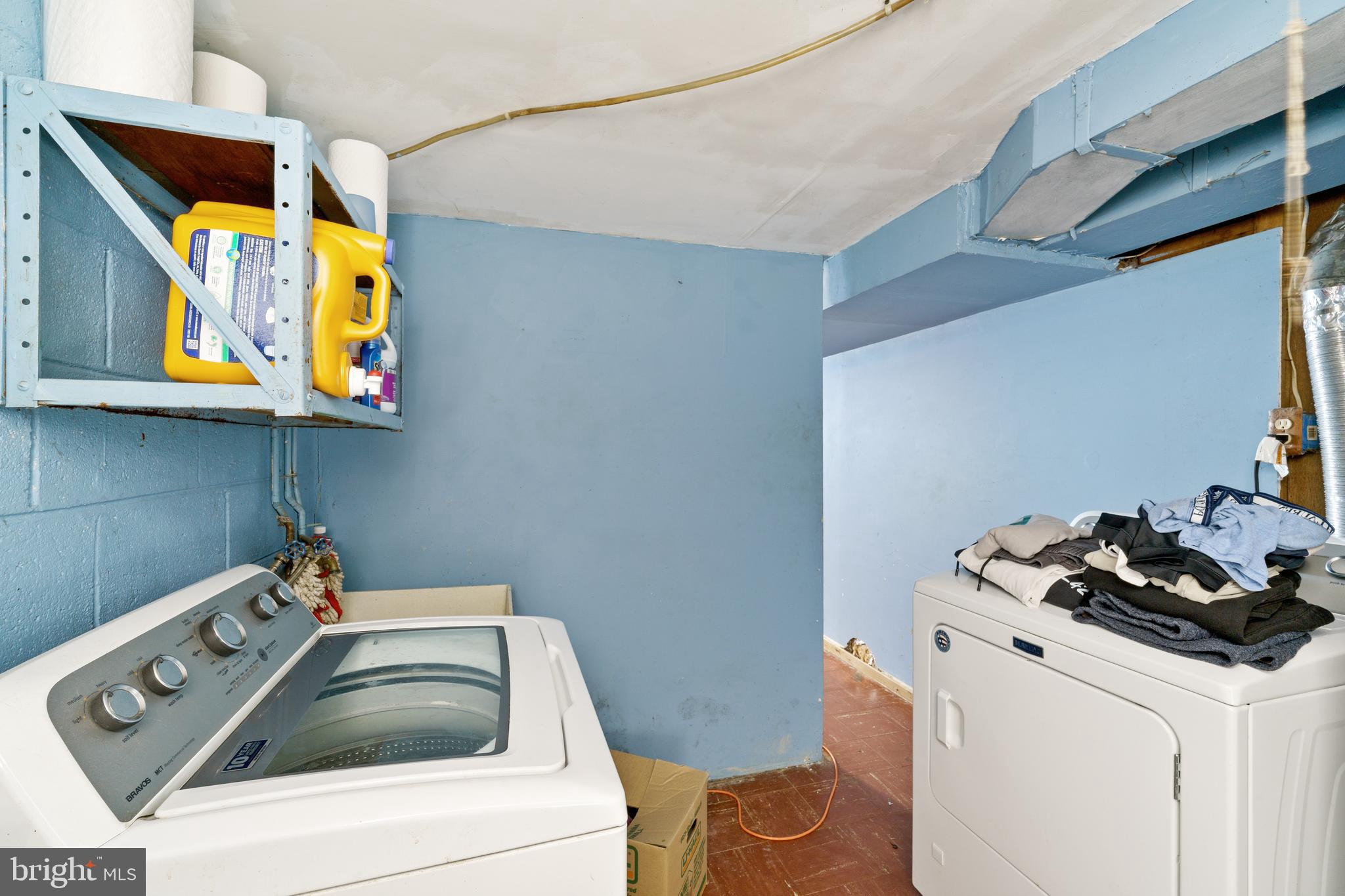 12718 Elnora Road Philadelphia, PA 19154 - Photo 21 of 25 a bathroom with a sink and a stove with wooden floor