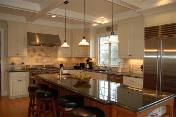 27 Oxford Road Wellesley, MA 02481 - Photo 6 of 19 a kitchen with stainless steel appliances granite countertop a sink a stove and a refrigerator